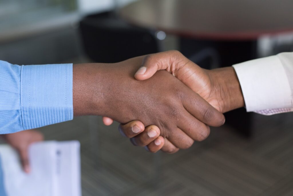 a handshake representing the start of a working relationship