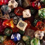 A handful of colorful multi-sided role-playing dice scattered on a surface